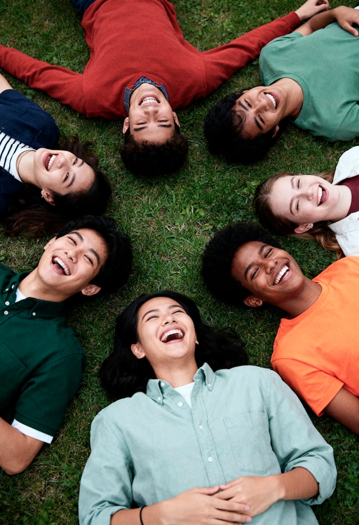 joyful-group-friends-laughing-grass_23-2152024620.jpg