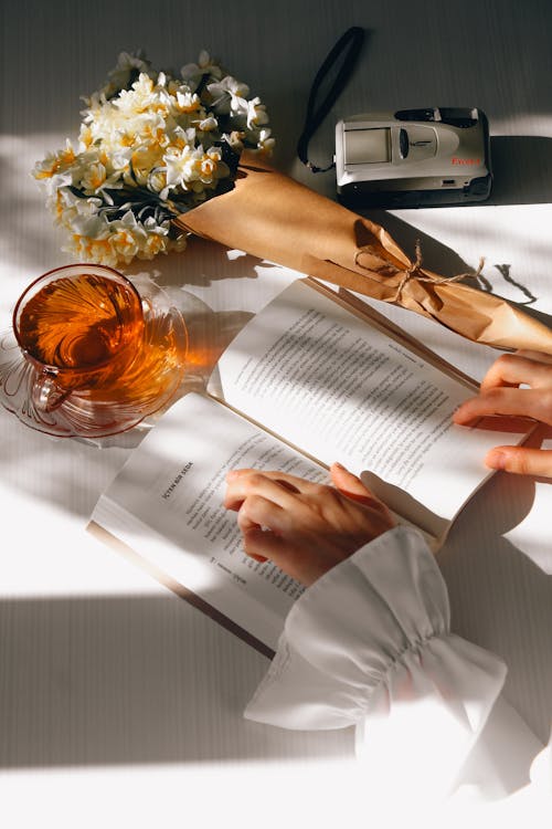free-photo-of-woman-hands-holding-book.jpeg